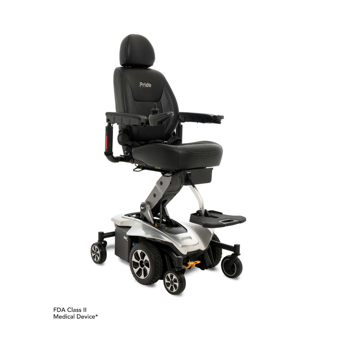 The Pride Mobility Jazzy Air®2 Powerchair with Seat Elevation is a sleek black chair featuring a cushioned seat, backrest, armrests, and foot platform. It provides elevated mobility with joystick control on the right armrest and sturdy wheels. Its silver base beautifully displays the branding.